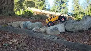 injora mud terrain crawler tires mt. These sell for under $20 and perform amazingly well on rocks.