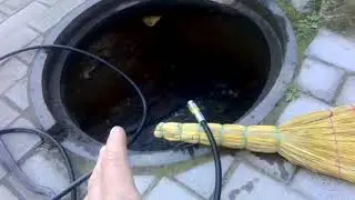 Cleaning the drain with a pressure washer
