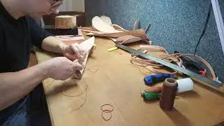 Sewing leather seax scabard with saddle stitch.