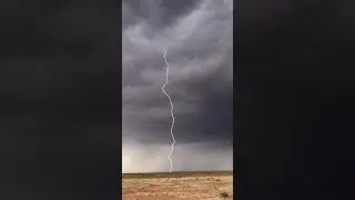 Big time lightning strike yesterday from a high-based supercell producing ping-pong ball size hail.