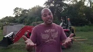 Using my Kioti 2610 to clean up the yard
