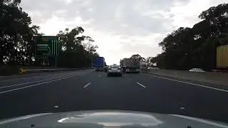 Blue Toyota Aurion, BU28VH crossing a solid line on the M5 Motorway