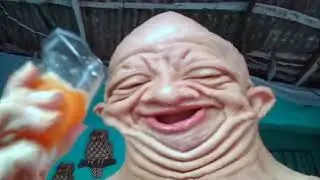 bald guy drinking orange juice, but it's distorted [REVERSE]