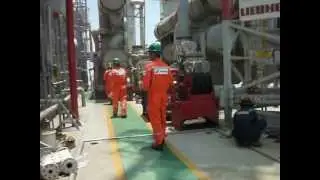People Working on an Offshore Oil Platform in Indonesia (repairing a glycol pump)