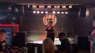 Amy singing “All the Jazz” at karaoke