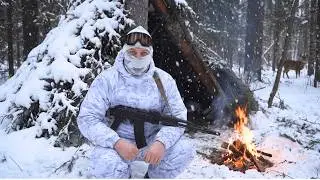 I am building a hunter's shelter alone in a snow-covered winter forest