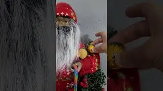 Ishan decorating  Santa with Chocolates