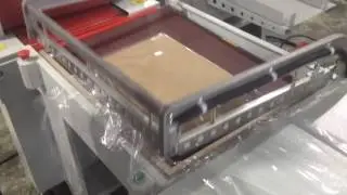 Термоусадочная машина полуавтомат FL-7555TB+SM-5030 - демонстрация на складе