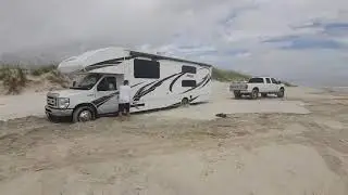 how is this possible?tug wars ford f250 pulling ford E450 big motorhome out of the sand on the beach