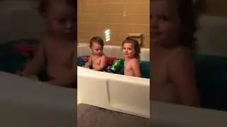 What a Toot! Little Girl Makes Bubbles at Bath Time