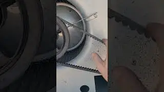 Changing a belt on a commercial package unit.