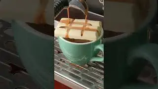 Shot of Espresso Over a Bar of White Chocolate.