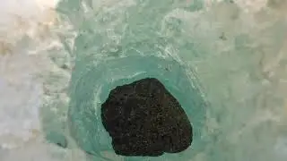 Weird rock sinking into the ice