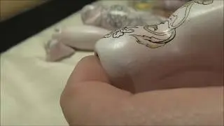 Porcelain ball jointed doll process of painting the tattoo by Amado Gravagno