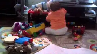 Teya will most likely be standing up soon and emptying the toy box faster!