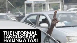 Hand signals for hailing taxis in Abuja, Nigeria