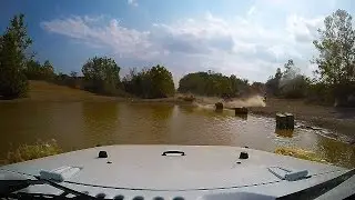 Stock Jeep Wrangler Sahara JK off road water crossing at Badlands Off Road Park