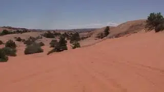 Jeep jumps unexpectedly in the sand.