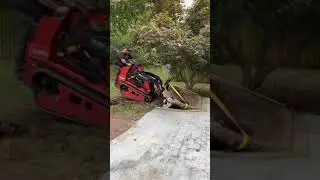 Taking out concrete coy pond with Toro Dingo TX 1000