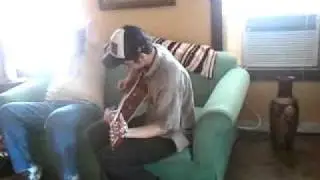 Burns playing guitar