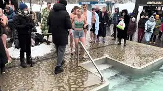 People dive into cold water. Air temperature -7°C degrees according to tradition on January 19