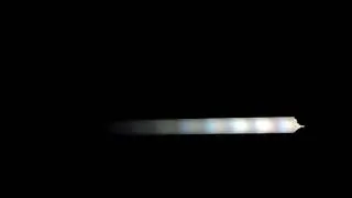 High speed recording of a longitudinal wave in a fluorescent tube.