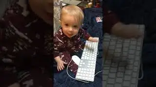My child protégé son hacking the planet with an Apple.