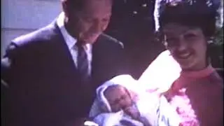 9  Mom and Dad holding godchild
