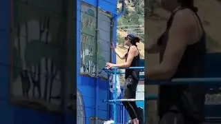 Napa's Grove 45 muralist at work