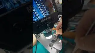 iPhone motherboard fixing thorough microscope