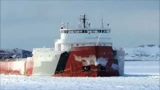 The Coast Guard's Ice Breaker Biscayne Bay keeps the ice clear for the Roger Blough at the Soo Locks