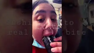 Stuffing my mouth with a sushi burrito