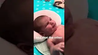 My granddaughter is precious! Baby spit up. 