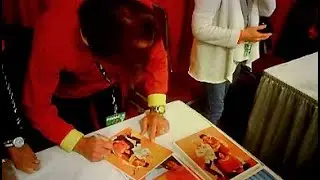 Shazam's Michael Gray signing autographs.
