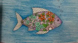 I'll be coloring a cute little fish in Small Victories by Johanna Basford with Grizaye pencils.