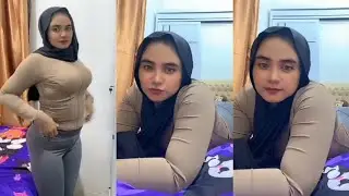 Beautiful, sweet, natural hijab mother lying alone in bed