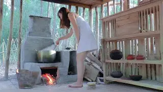 The girl braved the heavy rain, build shelter under a large rock 8