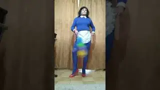 Crossdresser transvestite. a maid in red stiletto heels and blue tights.