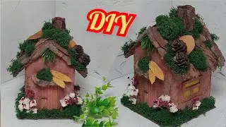 A miniature house made of cardboard and natural material. Diy crafts. cardboard crafts.