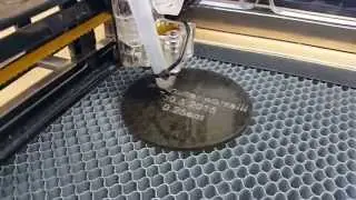 A asercutter that I designed and built into my desk, from scratch.