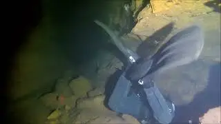 France - Gour Bouclans, buddy going through side tunnel at the end of S1