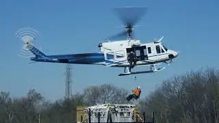 Duke Energy Helicopter carrying workers onto Powerlines