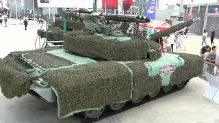Т-72Б3М в накидке, с серийным козырьком и с противодроновой системой "Тритон". МВТФ "Армия-2023".