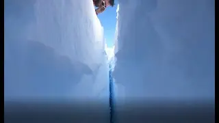 Visiting a small patch of ice holding on an iceberg twice the size of New York