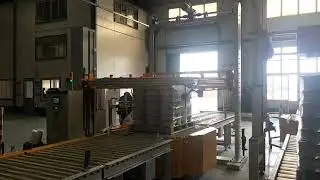 Online pallet wrapper with top sheet dispenser