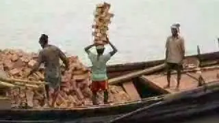 Dude transports 22 bricks on his head