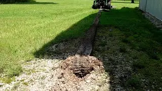 John Deere 1025R pulls out 60 feet 4 inch drain tile STRETCHES to 120 FEET