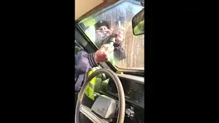 Russian Police Checking Taxi Window Tenting With a Tent Meter