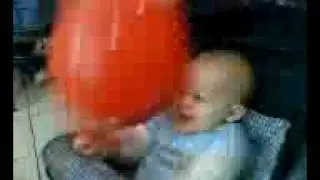 Sebastian Thomas Hamilton playing with a balloon at the mall