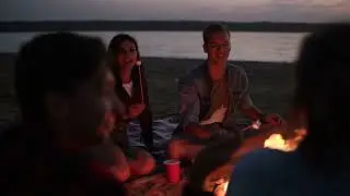 Lovely Couple Roasting Marshmallows On A Bonfire, Kissing